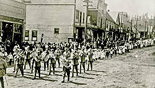 Parade down First Street, early 1900s